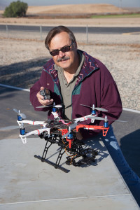 Here the author is detting ready to do some aerial photography by attaching a GoPro camera to the front of this DJI Flamewheel 550.