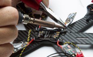Soldering up a drone racer power board
